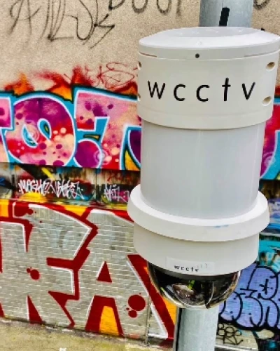 Redeployable Camera in Front of Graffiti - Tall Thumb