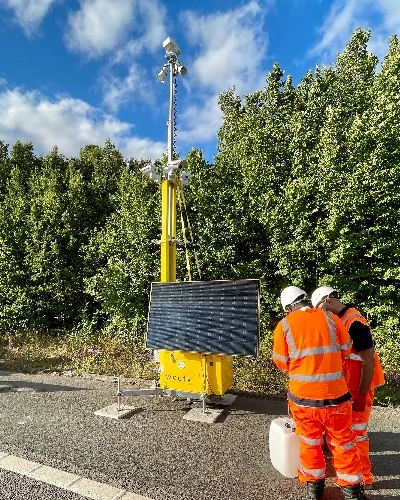 Two Engineers Install CCTV Tower - Tall Thumb