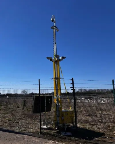 Blog Tall CCTV Tower behind a gated fence with Solar option