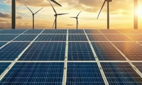 Blog Wide Solar Farm and wind turbines at dusk
