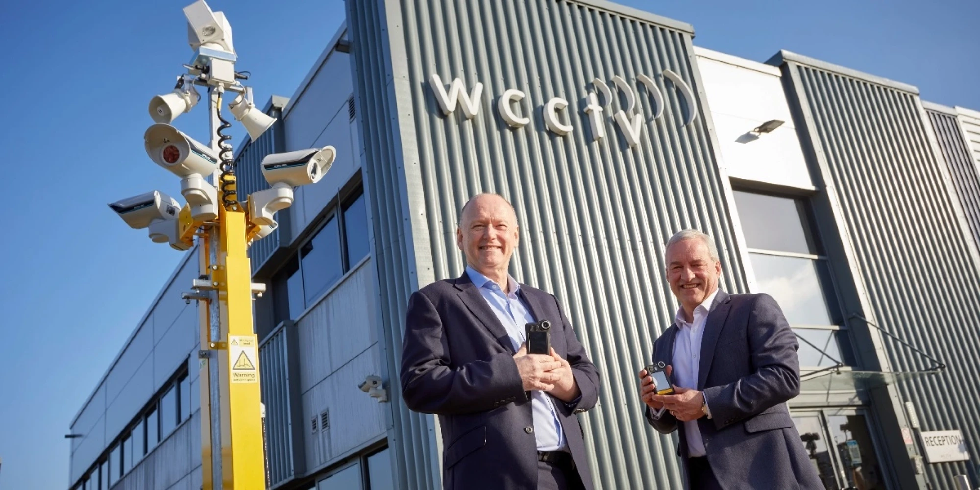 WCCTV's Chairman and CEO Pictured Outside the Company's Headquarters