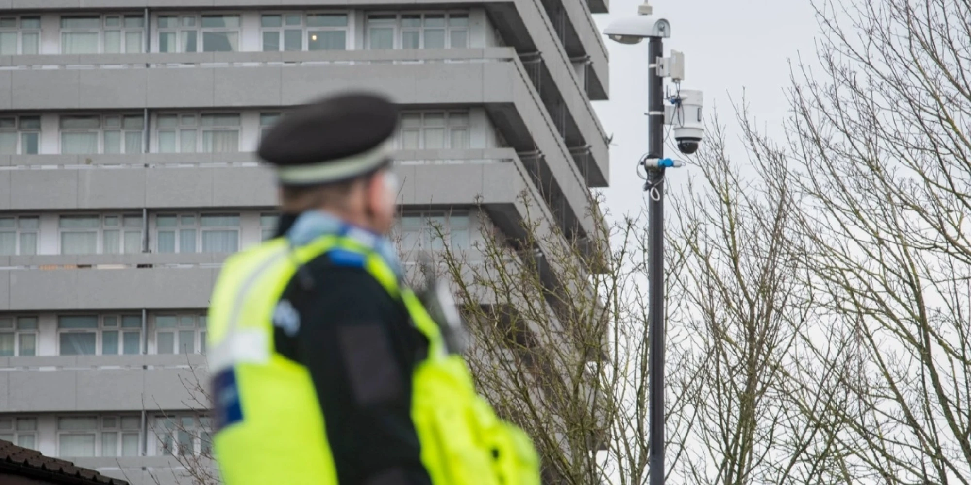 Police Officer Looking at a WCCTV Redeployable CCTV Camera Installed on Lamppost