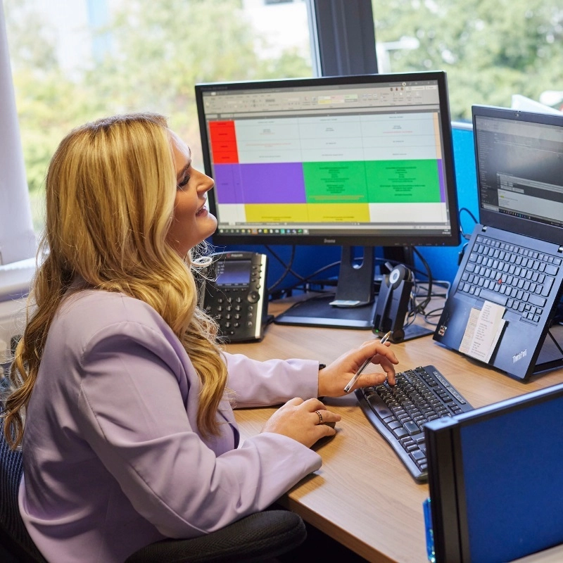 WCCTV Support Team Member Working at Desk