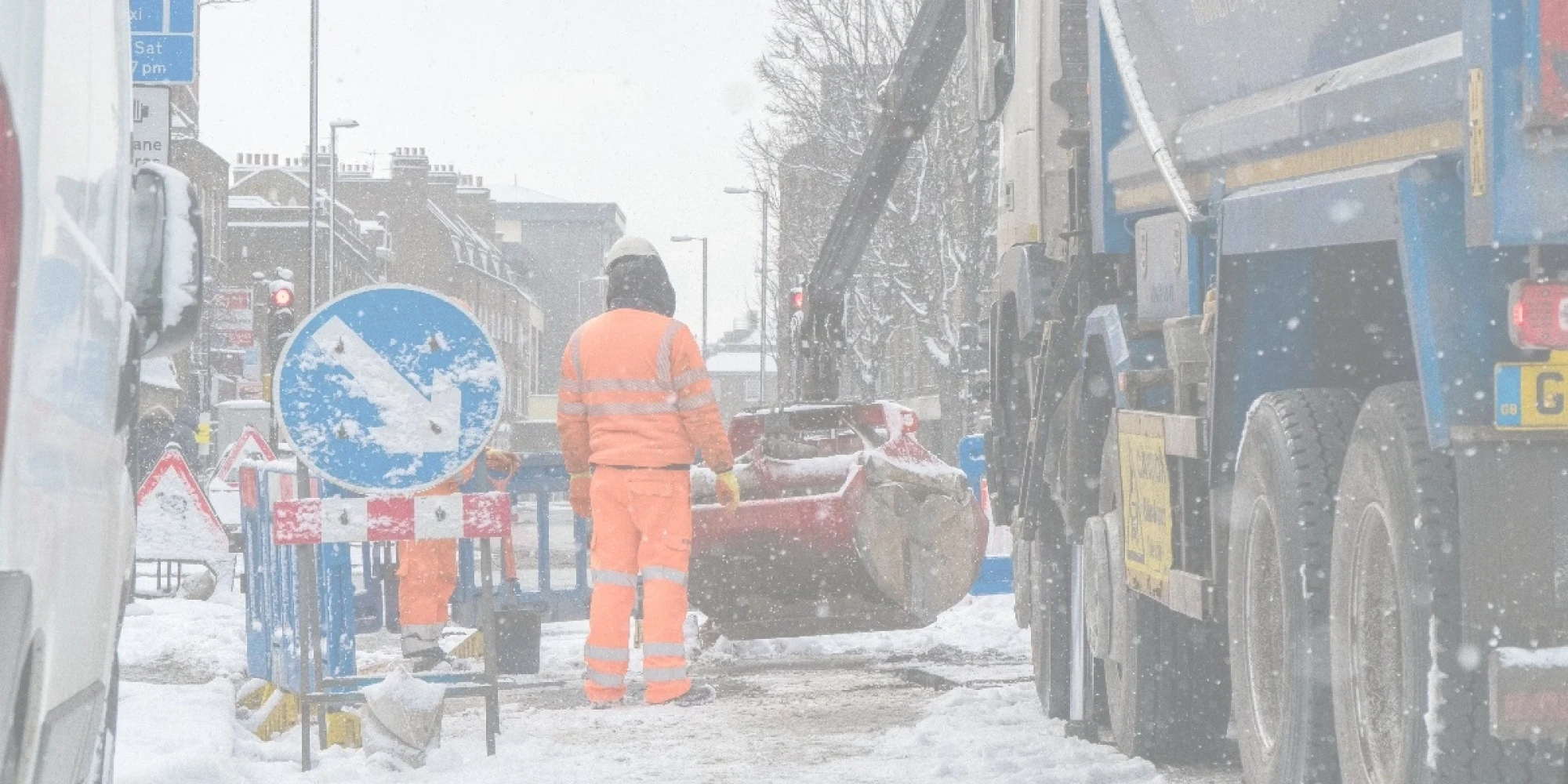 Road Construction Worker in Snow