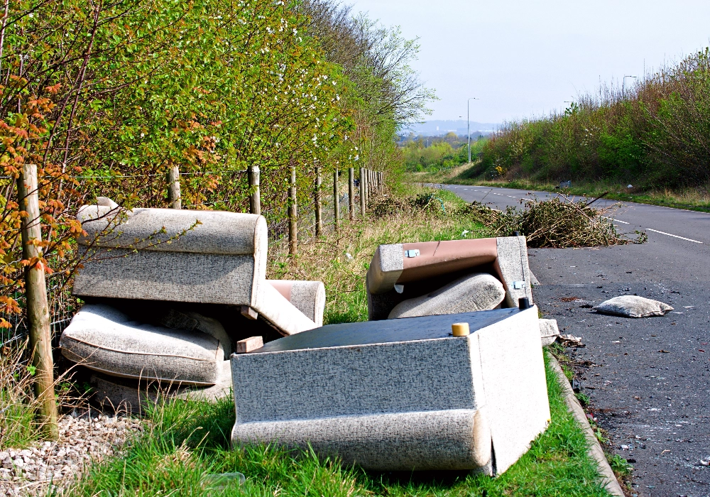 Fly-Tipping of Sofa by a Road