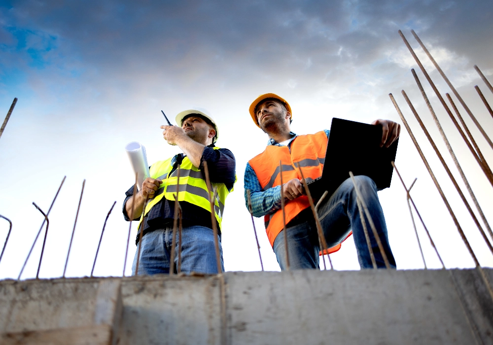 Two Construction Workers Survey Site