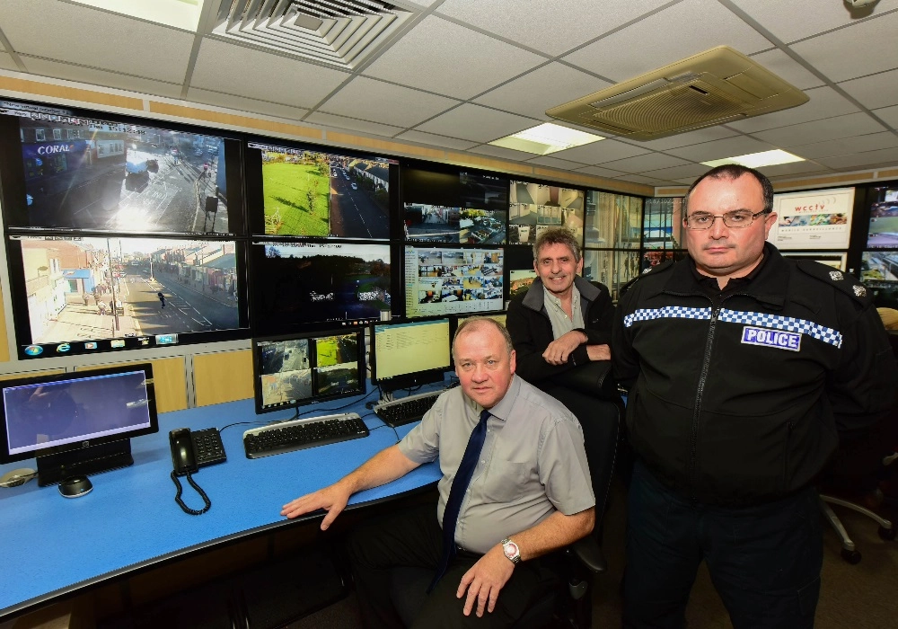 Untitled (48People in a CCTV Control Room with WCCTV Cameras Running in Background